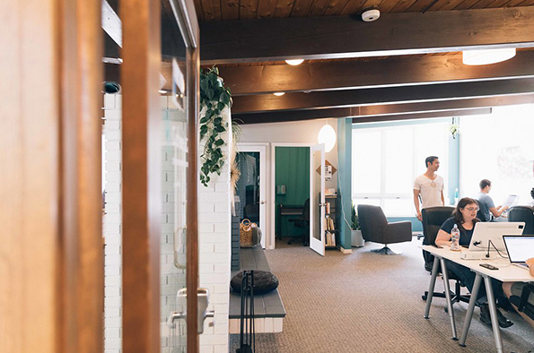 Multi-ethnic business people working at desk in office