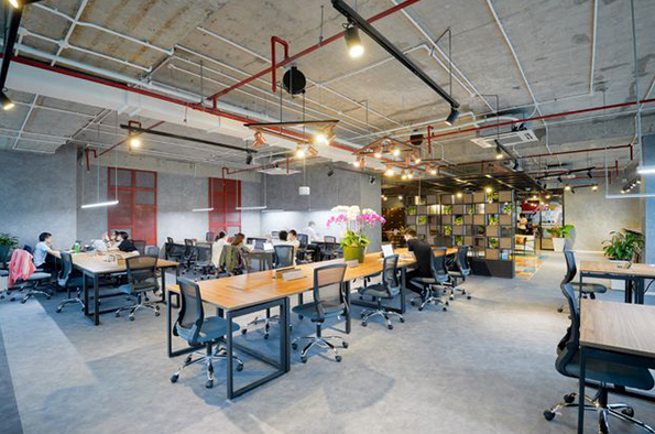 Multi-ethnic business people working at desk in office