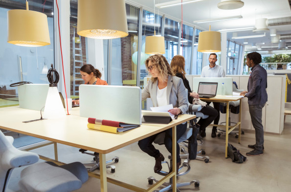 Multi-ethnic business people working at desk in office